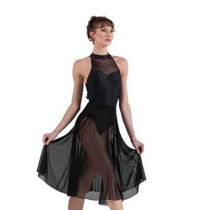 Dancer in a black leotard and skirt on white background