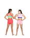 Two women wearing colorful sports bras and shorts on a white background