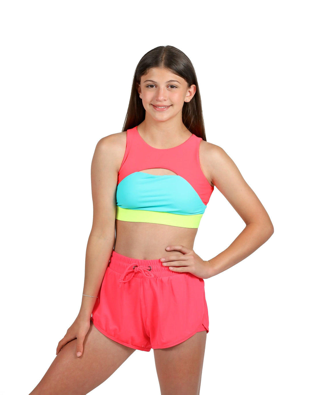 Young girl wearing a colorful two-piece swimsuit on a white background