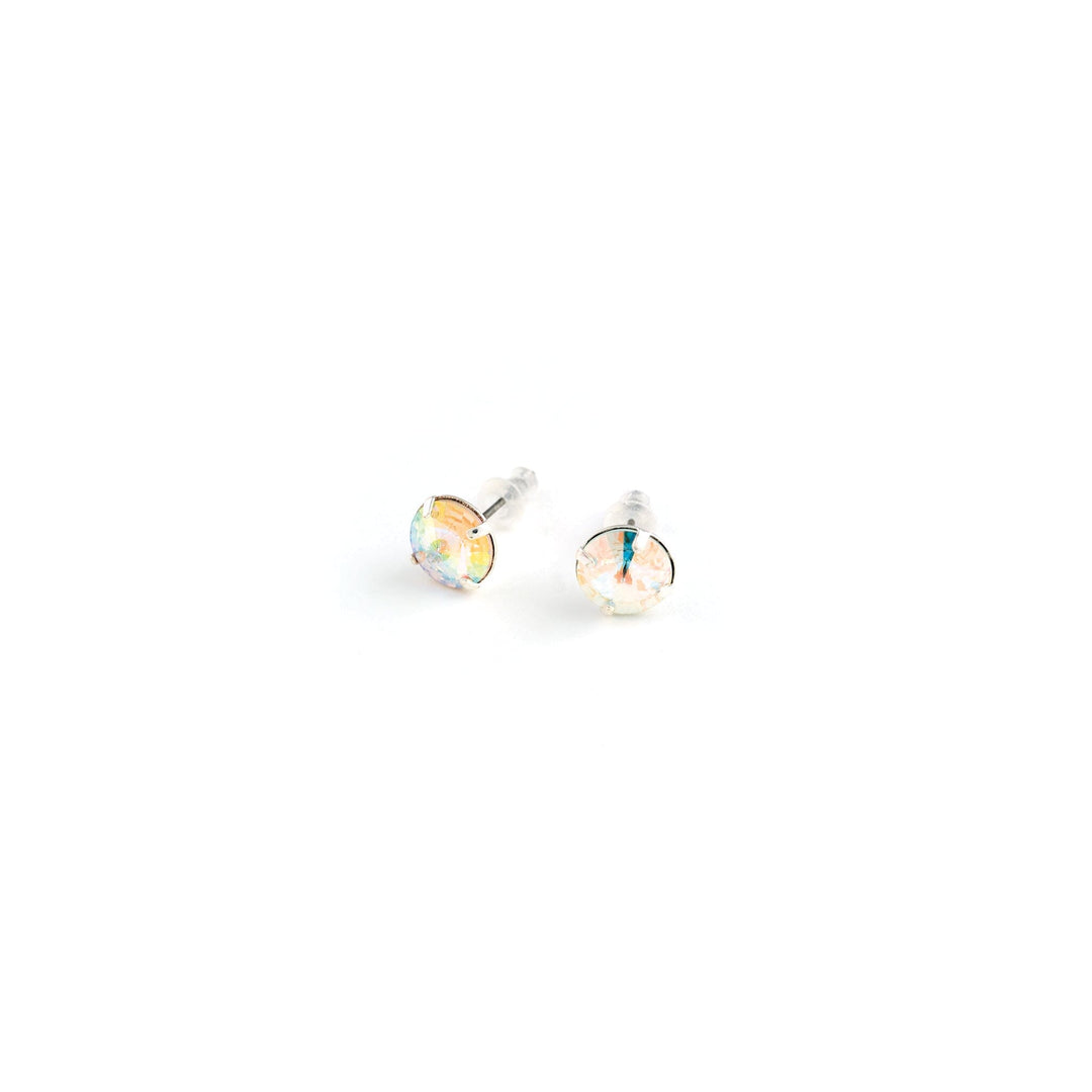 Pair of round stud earrings on a white background