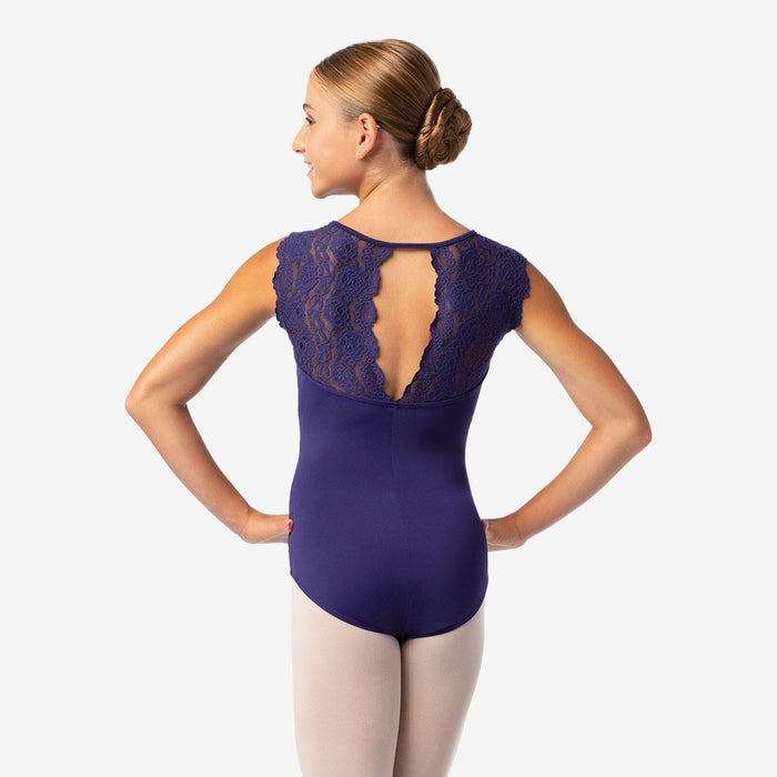 Woman wearing a purple ballet leotard with lace detailing on a white background