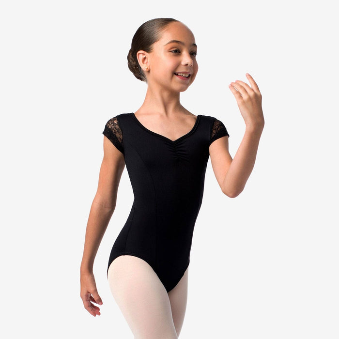 Young girl wearing a black ballet leotard on a white background