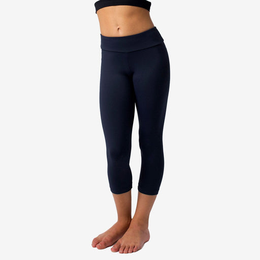 Navy blue leggings worn by a person on a white background