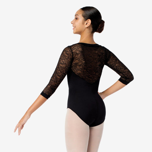 Ballerina wearing a black lace leotard on a white background