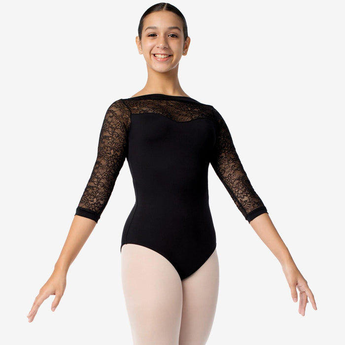 Ballerina wearing a black leotard with lace sleeves on a white background