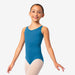 Young girl wearing a blue leotard on a white background