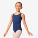 Young girl wearing a navy blue leotard on a white background