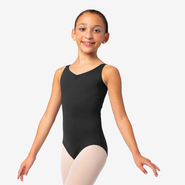 Young girl wearing a black sleeveless leotard on a white background