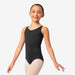 Young girl wearing a black sleeveless leotard on a white background