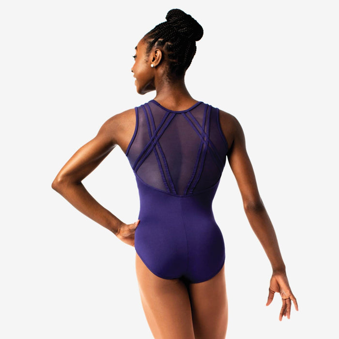 Woman wearing a purple leotard with mesh back design on a white background