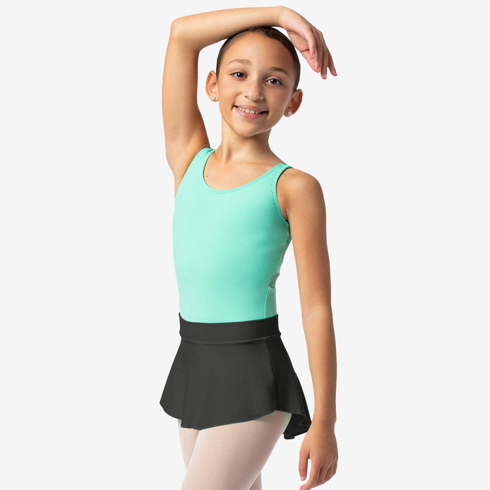 Young girl in a green leotard and black skirt posing against a white background