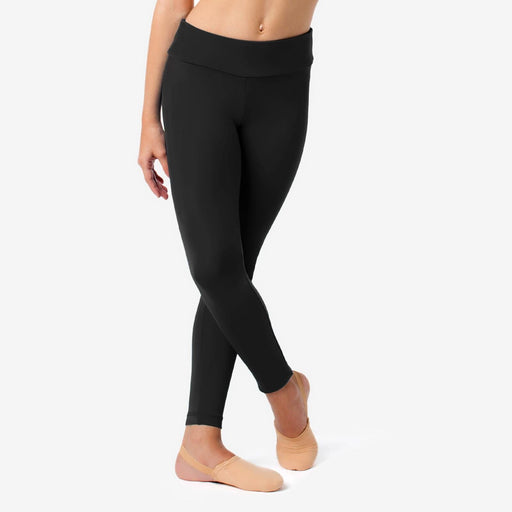 Person wearing black leggings on a white background
