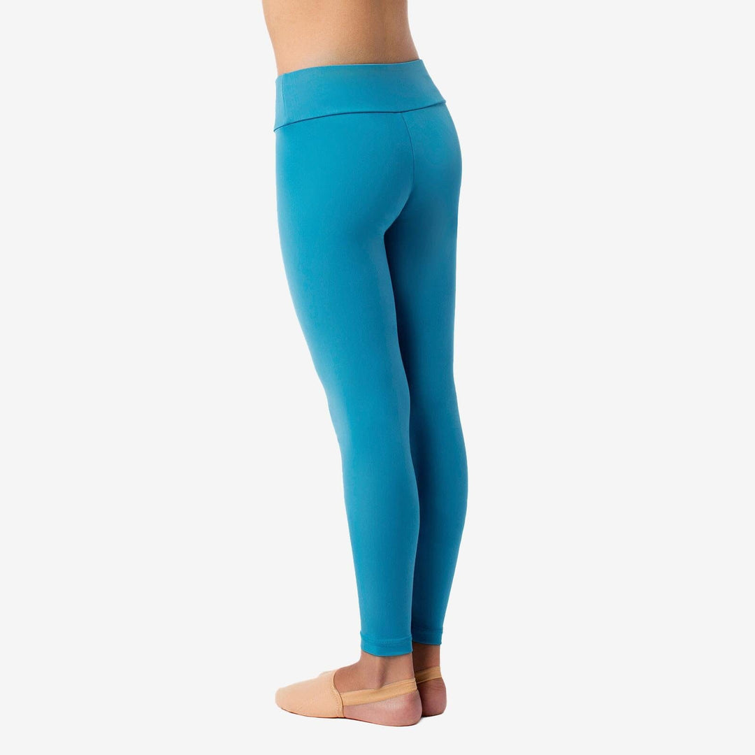 Blue leggings worn by a person on a white background