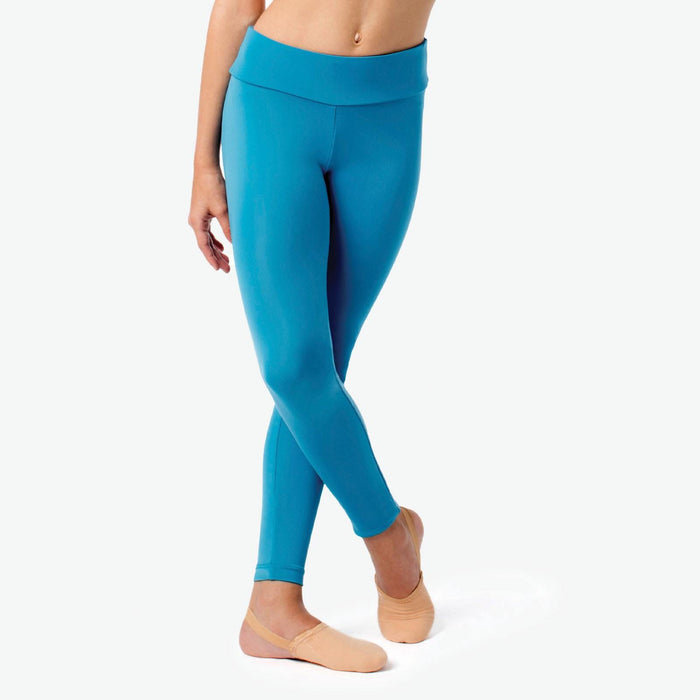 Person wearing teal leggings on a white background