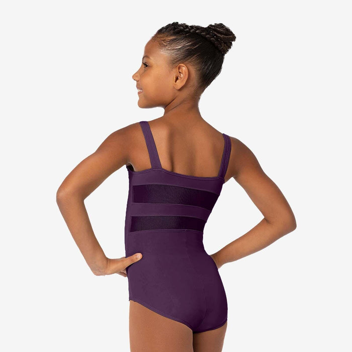 Young girl wearing a purple leotard on a white background