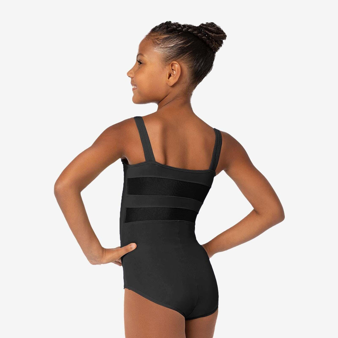 Young girl wearing a black leotard on a white background