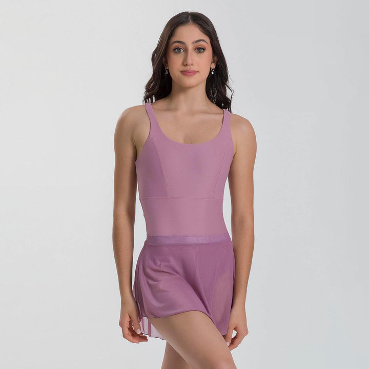 Woman wearing a purple athletic outfit on a white background