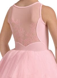 Close-up of a pink dress with lace detailing on a white background