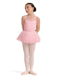Young girl in a pink ballet outfit on a white background