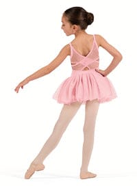 Young girl in a pink ballet outfit on a white background