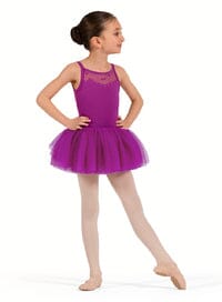 Young girl in a purple ballet outfit on a white background