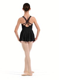 Person wearing a black leotard with criss-cross straps on a white background