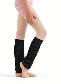 Person wearing black leg warmers on a white background