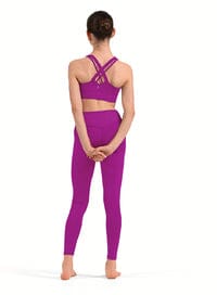Person wearing a purple athletic outfit on a white background