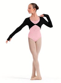 Dancer wearing a black and pink leotard on a white background