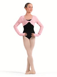 Ballerina in a black leotard and pink cardigan on a white background
