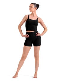 Woman wearing a black tank top and black shorts on a white background