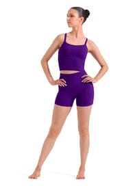 Woman wearing a purple leotard on a white background