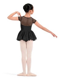 Dancer in a black leotard and tights on a white background