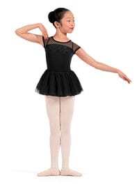 Young girl in a black ballet outfit on a white background