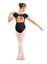 Ballerina in a black leotard and pink tights on a white background