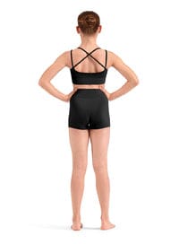 Person wearing a black sports bra and shorts on a white background