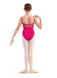 Ballerina in a pink leotard with open back on a white background