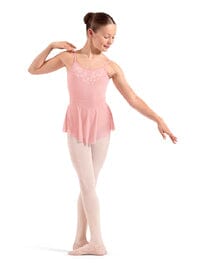 Ballerina in a pink leotard and tights on a white background
