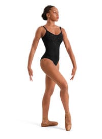 Dancer in a black leotard on a white background