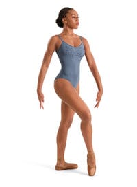 Dancer in a blue leotard on a white background