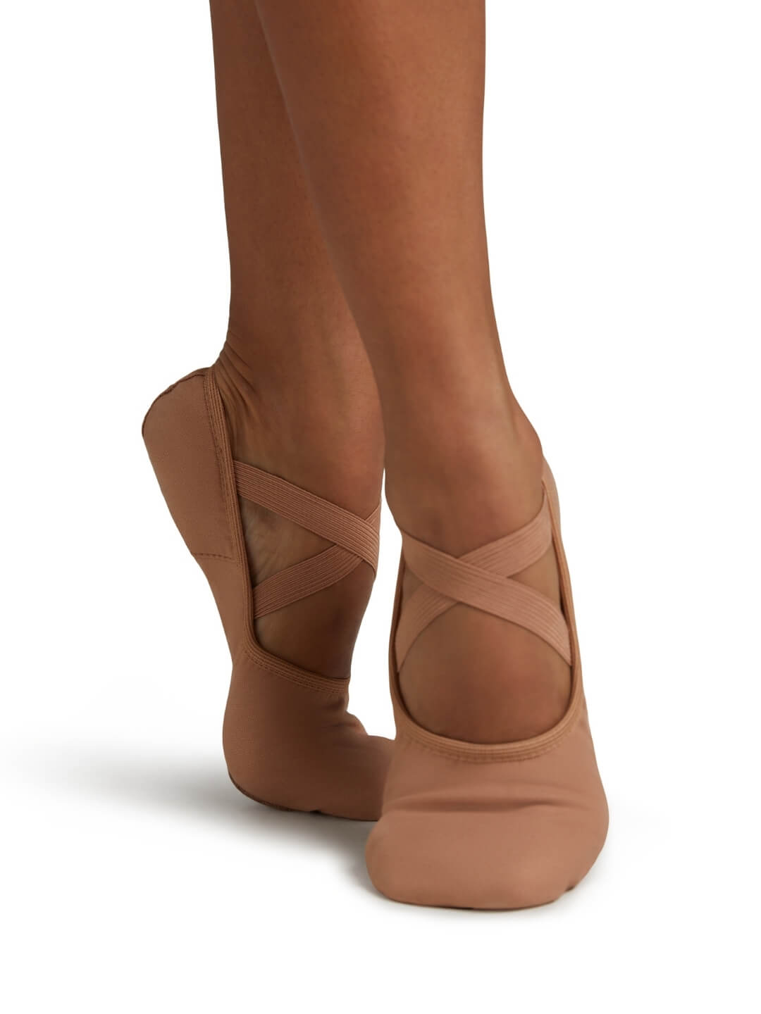 Brown ballet shoes with criss-cross design on a white background