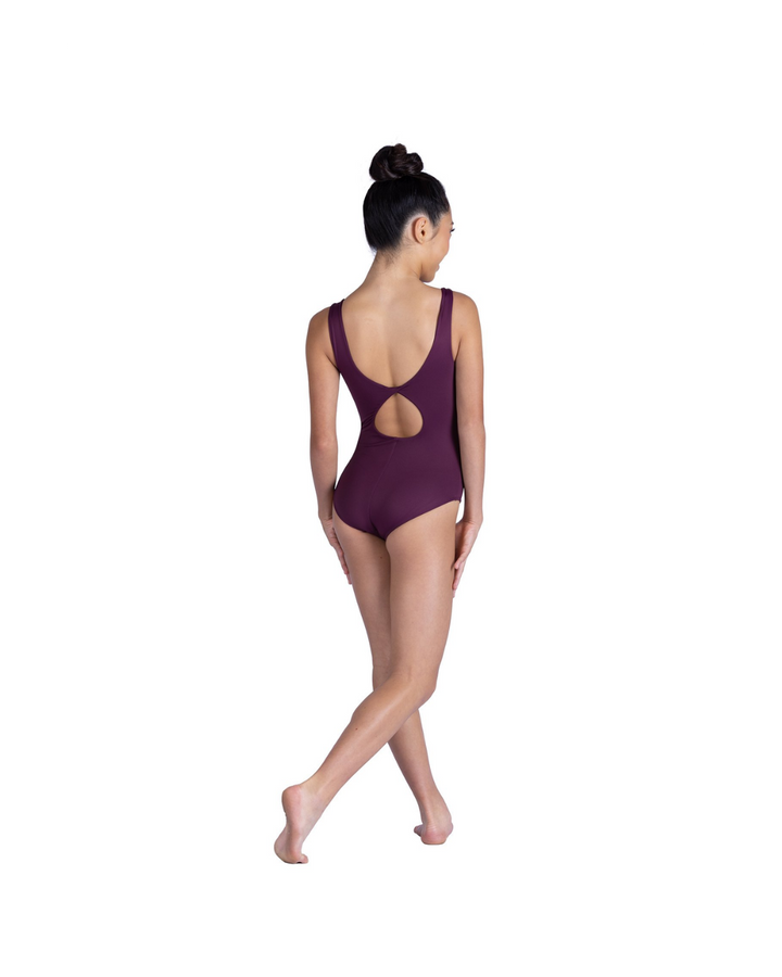 Person wearing a purple leotard with cut-out design on a white background