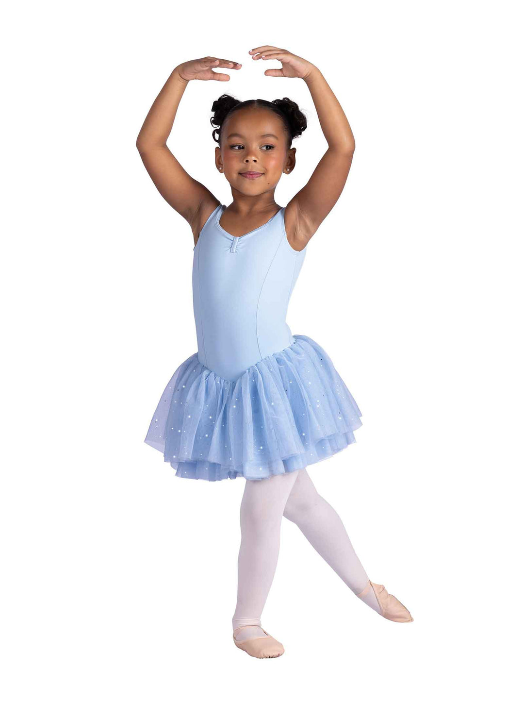 Young girl in a light blue ballet dress posing on a white background