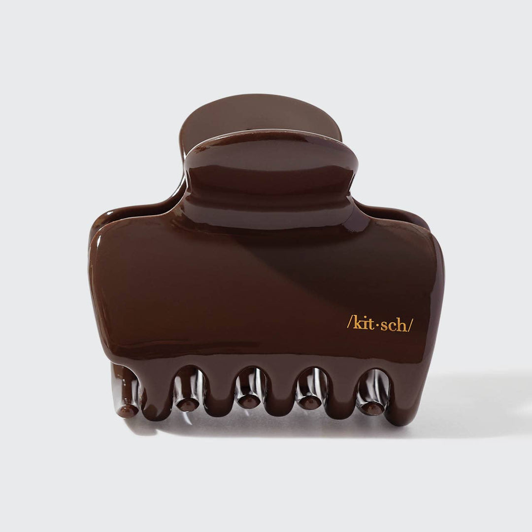 Brown hair clip with 'kit-sch' branding on a white background