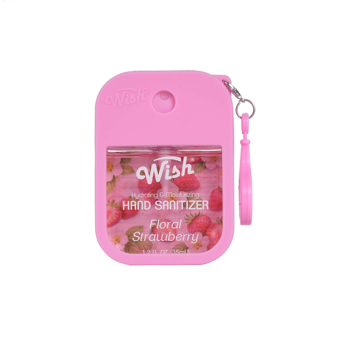 Pink Wish Hand Sanitizer in a compact rectangular case with a wrist strap, featuring a clear window showing strawberry-themed liquid and text reading 'Wish Hand Sanitizer Floral Strawberry'.