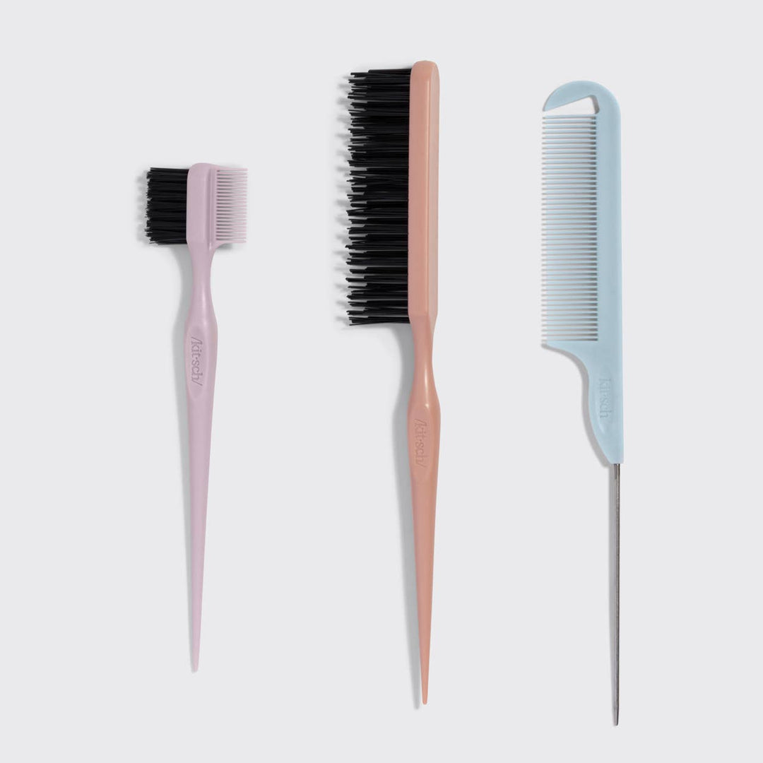 Three hairbrushes with different bristle types on a light gray background