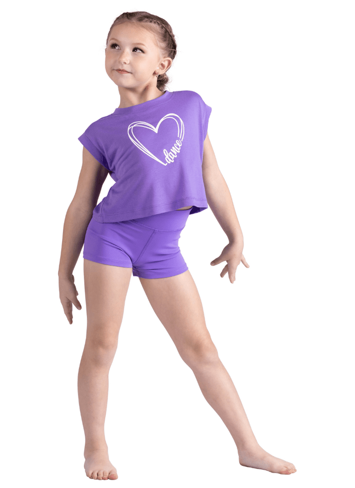 Young girl in a purple outfit with a heart design on a white background