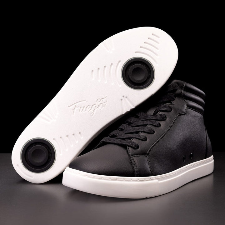 A pair of black high-top sneakers with a white sole, showcasing the sole's design and the signature flame branding on the side.