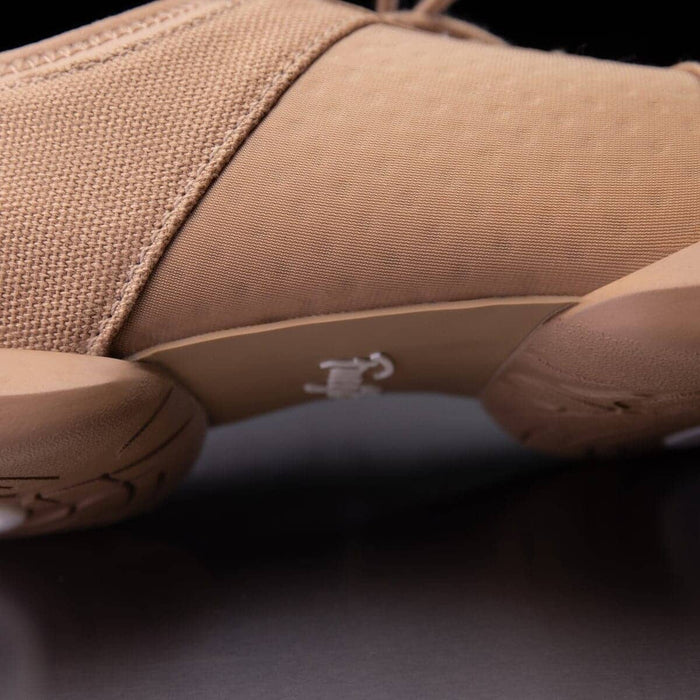 Close-up of a brown shoe sole with a dark background