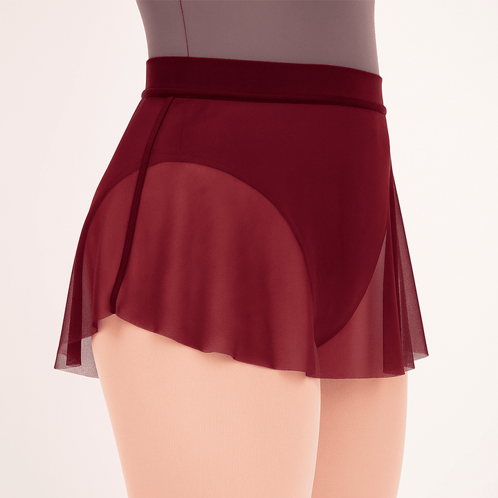 Burgundyskirt with sheer overlay on a neutral background